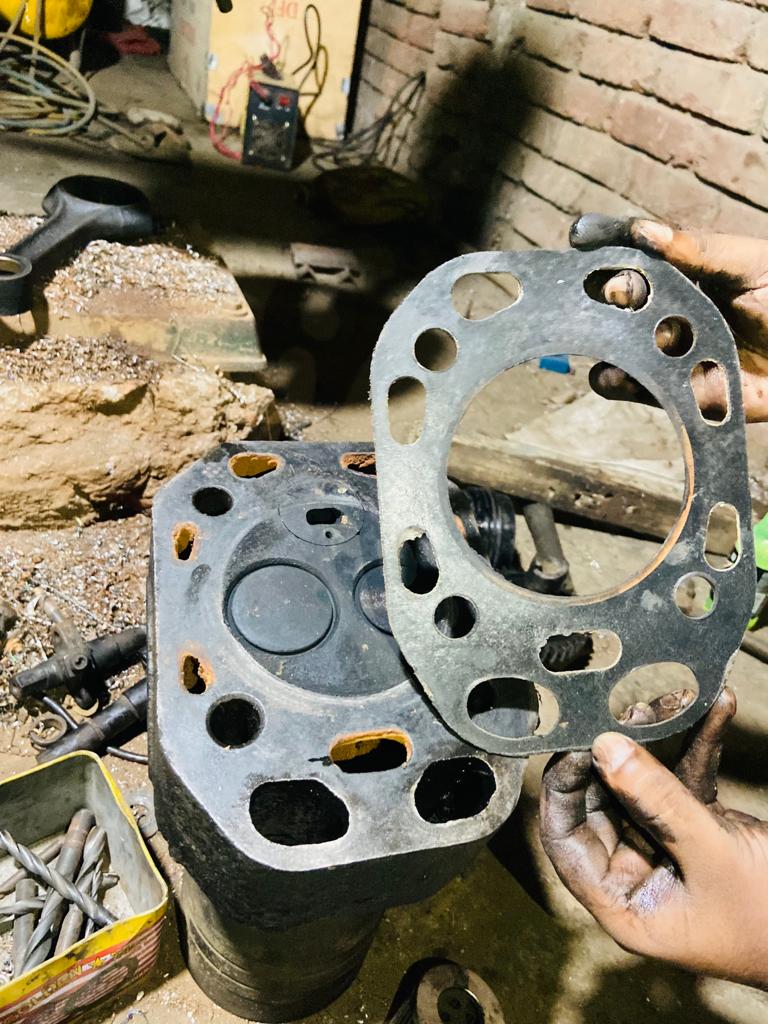 Remove the damaged gasket and clean the area to solve engine ticks when accelerating