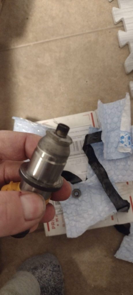 Fuel injector my car hesitates when warmed up because of fuel injector leaking